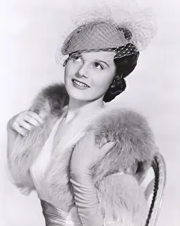 Daydreaming: Woman in veiled hat and fur stole