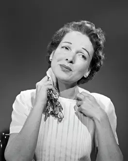 Menopause: Woman Too Warm - Sweating - Pulling at Collar of Blouse