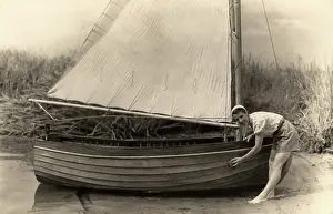 Anglia: Woman washing down boat