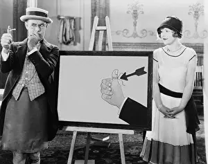 Salesmen: Woman watching thoughtful man with string tied to