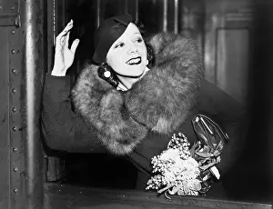 Sophisticate: Woman waving from the window of a train