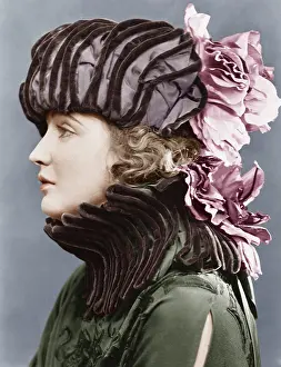 Pleat: Woman wearing elaborate hat