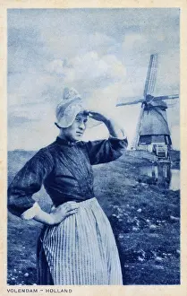 Windmills: Woman and windmill, Volendam, Netherlands
