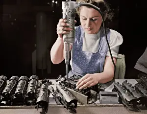 Haven: Woman worker using an electric screwdriver