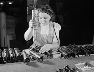 Haven: Woman worker using an electric screwdriver