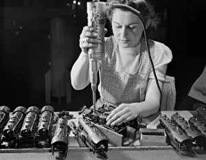 Haven: Woman worker using an electric screwdriver