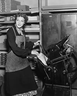 Copying: Woman working in print shop