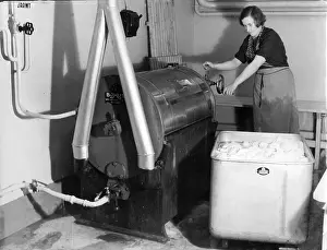 Functions: Woman works an automatic washing machine