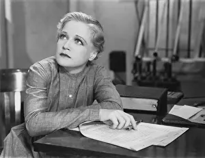 Responsibilities: Woman writing at desk