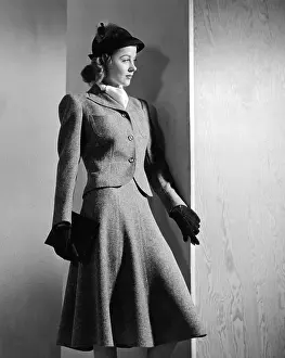 Emphatically: Woman's suit with a short narrow waisted ?