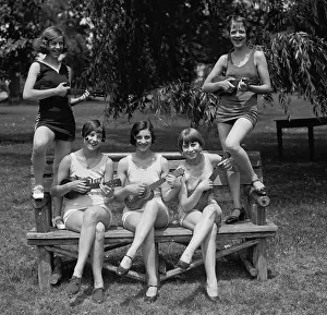 D.c. Vicinity: Women in bathing suits pose playing ukuleles. Washington