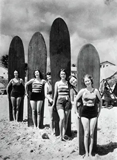 Surfing: Women on the beach in Long Beach /