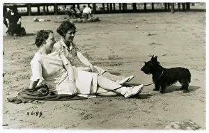 Scottie: Two women on beach with Scots terrier