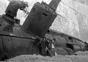 Shingle: Three women with beached submarine