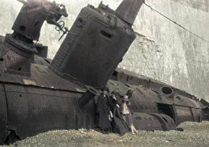 Shingle: Three women with beached submarine