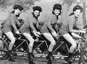 Conformity: Four women on a bicycle