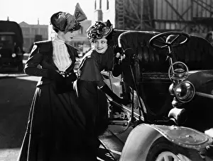 Interactions: Two women with car