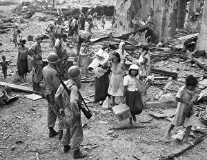 Philippine Islands: Women and children picking their way barefooted