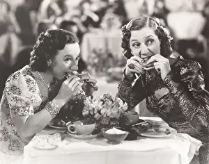 Distraction: Two women distracted from their meal