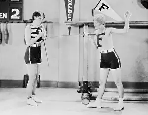 Epee: Two women doing fencing practice