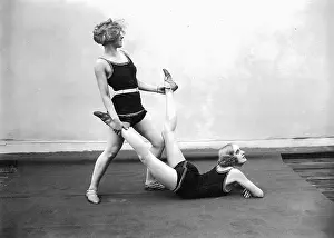 Two women doing gymnastics, 1926