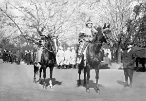 Two women dressed as Indians on horseback at the