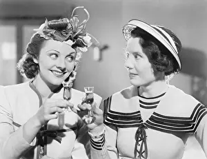 Ecovgc0176: Two women drinking a schnapps