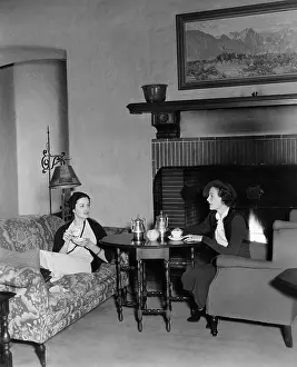 Reclined: Two women drinking tea and talking