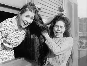 Scream: Two women fighting and pulling each others hair