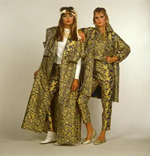 Pout: Two women in gold patterned outfits