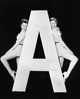 Testimonial: Two women with huge letter A