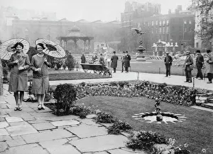 Parkway: Two women with Japanese umbrellas in