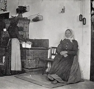 Headscarfs: Two women in the kitchen in heating or cooking. About