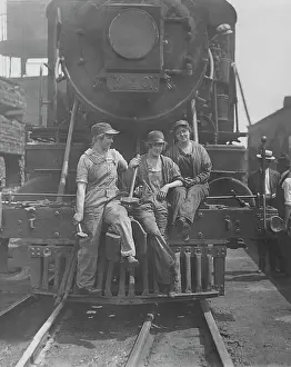 Freight: Women laborers seated on front of engine at