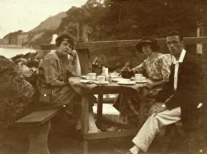 Teacup: Two women and a man at the seaside