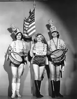 Leggy: Three women in a marching band