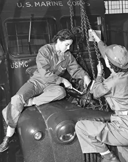 North Carolina: Women Marines lower a reconditioned engine back