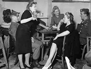 Barmaid: Women and military men in a pub