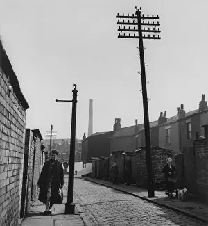 Cobblestones: Women in a narrow street with washing line