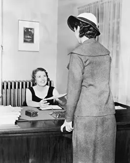 Employ: Two women at an office