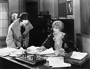 Employ: Two women in an office