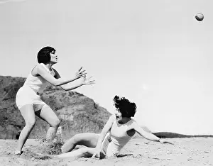 Scream: Two women playing with a ball at the beach