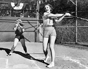 Mitt: Two women playing baseball