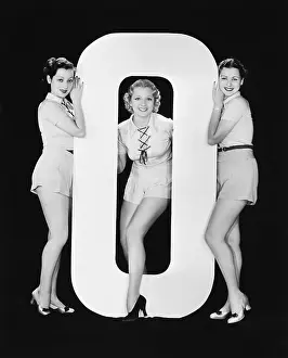 Vowels: Women posing with huge letter O
