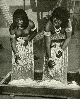 Rasping: Two women processing cassava, Brazil