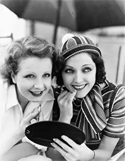 Girlfriends: Two women putting on makeup