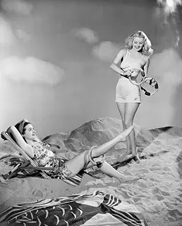 Tanning: Two women relax at the beach