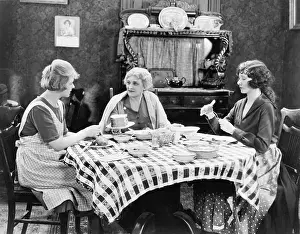 Kettles: Three women sitting at the dining table talking