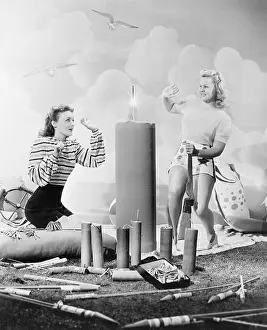 Celebratory: Two women sitting around fire works