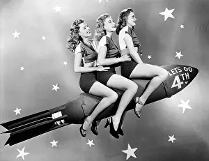 Conformity: Three women sitting on a rocket